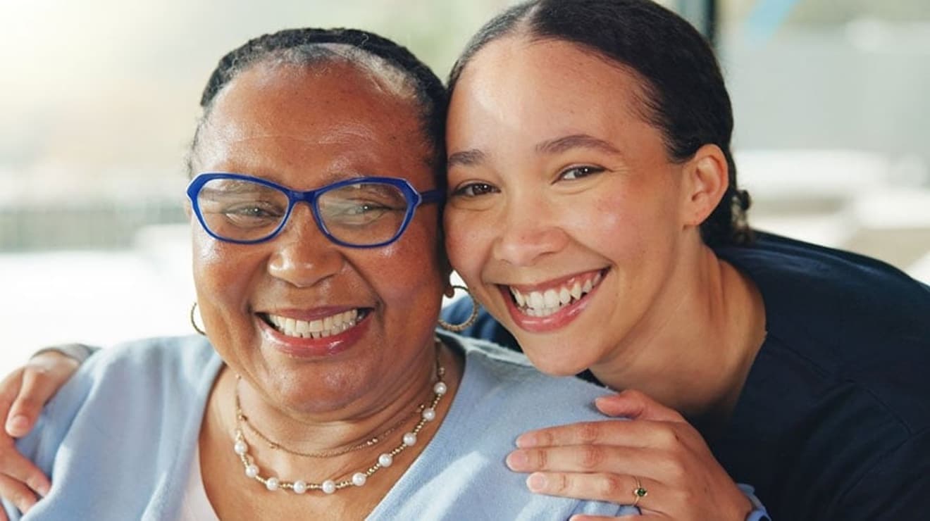 Mother and daughter smiling