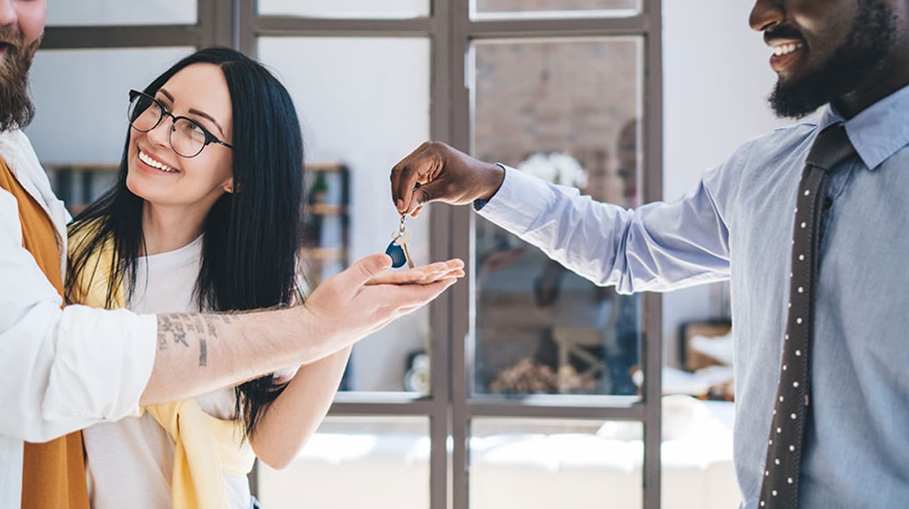 Landlord handing over keys to tenant