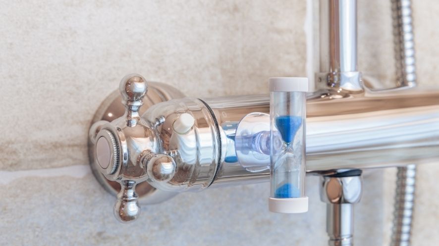 Shower sand timer attached to shower handle